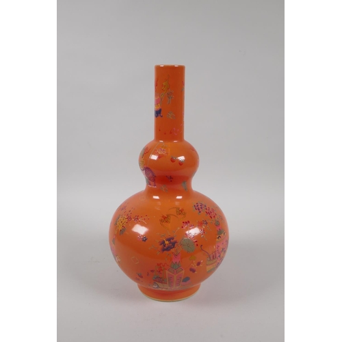 198 - A Chinese coral glazed porcelain double gourd vase with polychrome enamel decoration of objects of v... 