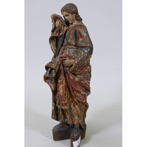 2 - A carved limewood figure of Saint John with polychrome and parcel gilt decoration and glass eyes, pr...