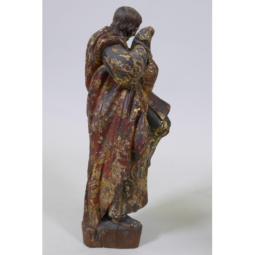 2 - A carved limewood figure of Saint John with polychrome and parcel gilt decoration and glass eyes, pr... 