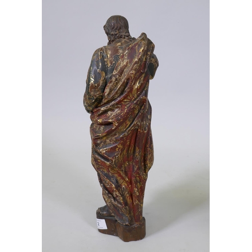 2 - A carved limewood figure of Saint John with polychrome and parcel gilt decoration and glass eyes, pr... 