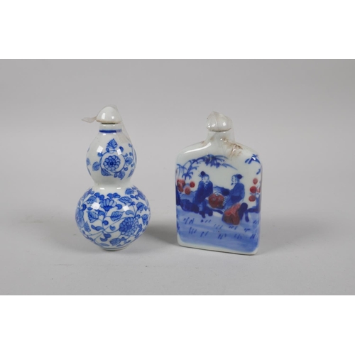 201 - A Chinese blue and white porcelain double gourd snuff bottle with scrolling floral decoration, and a... 