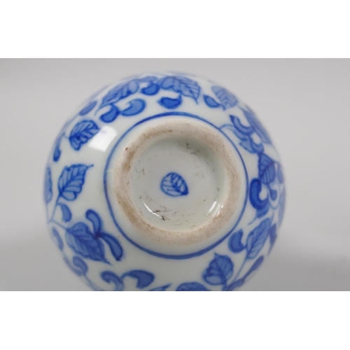 201 - A Chinese blue and white porcelain double gourd snuff bottle with scrolling floral decoration, and a... 