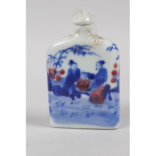 201 - A Chinese blue and white porcelain double gourd snuff bottle with scrolling floral decoration, and a... 