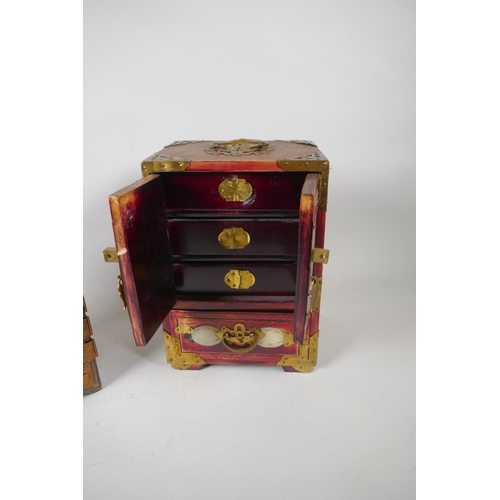 204 - An antique Japanese lacquer jewellery box with copper mounts and three hidden drawers, decorated wit... 