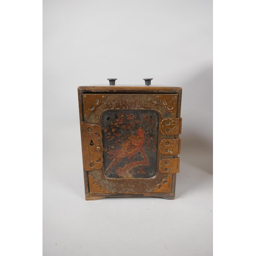 204 - An antique Japanese lacquer jewellery box with copper mounts and three hidden drawers, decorated wit... 