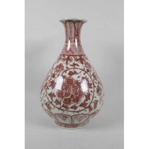 206 - A Chinese red and white porcelain pear shaped vase with scrolling lotus flower decoration, 32cm high