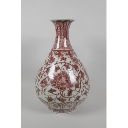 206 - A Chinese red and white porcelain pear shaped vase with scrolling lotus flower decoration, 32cm high