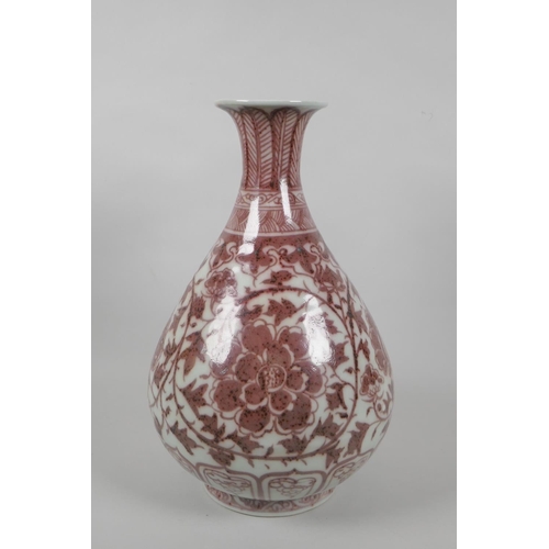 206 - A Chinese red and white porcelain pear shaped vase with scrolling lotus flower decoration, 32cm high