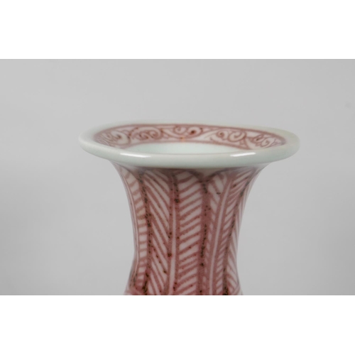 206 - A Chinese red and white porcelain pear shaped vase with scrolling lotus flower decoration, 32cm high