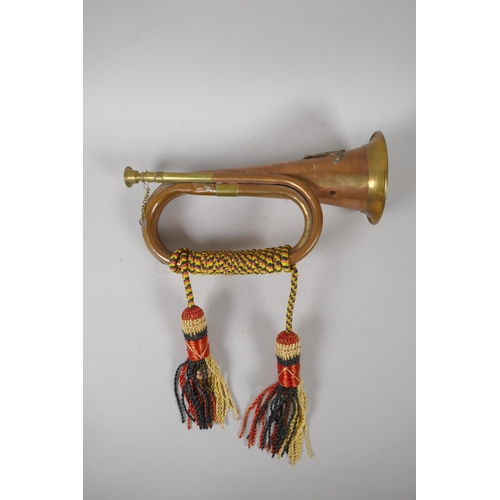 207 - A Royal Artillery brass and copper bugle, 28cm long