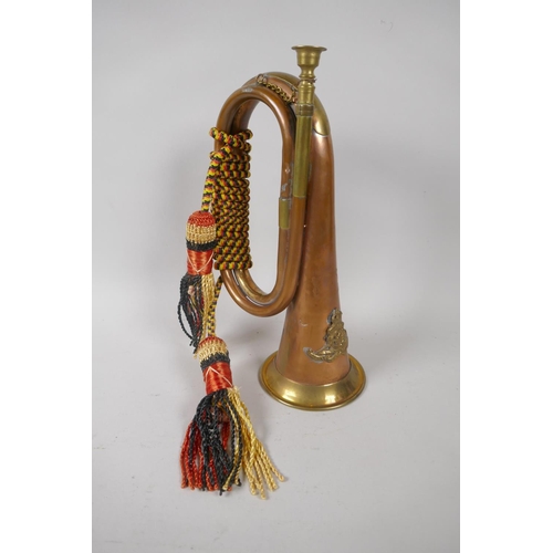 207 - A Royal Artillery brass and copper bugle, 28cm long