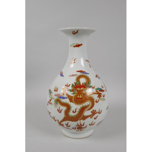 210 - A Chinese polychrome enamelled porcelain pear shaped vase decorated with gilt highlighted dragons, 6... 