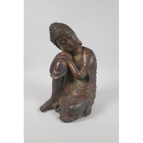 215 - A Chinese filled bronzed metal figure of Buddha with the remnants of gilt patina, 4 character mark t... 