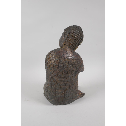 215 - A Chinese filled bronzed metal figure of Buddha with the remnants of gilt patina, 4 character mark t... 