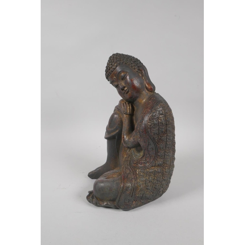 215 - A Chinese filled bronzed metal figure of Buddha with the remnants of gilt patina, 4 character mark t... 