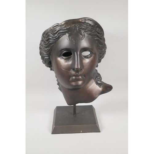 217 - A Greco-Roman style bronzed metal mask, 45cm high