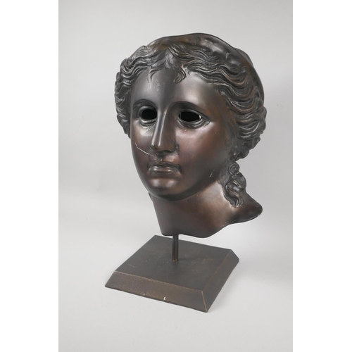 217 - A Greco-Roman style bronzed metal mask, 45cm high