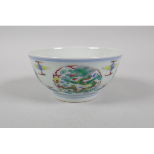 224 - A Chinese Doucai porcelain rice bowl with dragon decoration, YongZheng 6 character mark to base, 11c... 