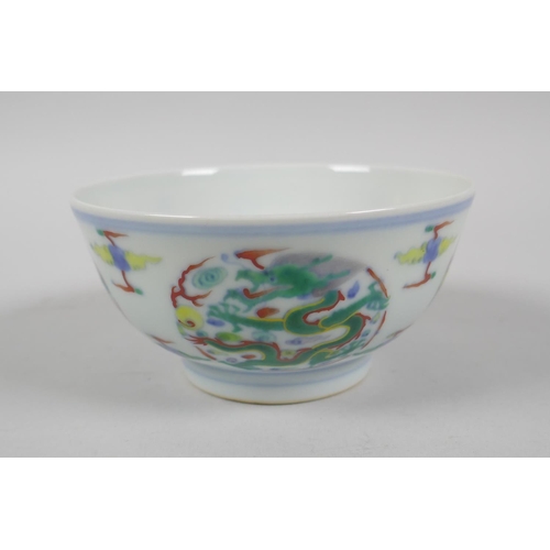 224 - A Chinese Doucai porcelain rice bowl with dragon decoration, YongZheng 6 character mark to base, 11c... 