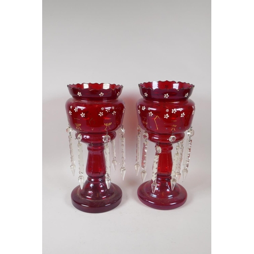 225 - A pair of Victorian ruby glass lustres with lobed rim, and a bohemian ruby glass bottle with etched ... 