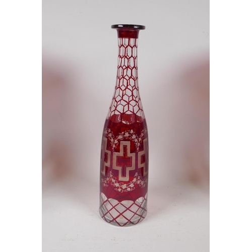 225 - A pair of Victorian ruby glass lustres with lobed rim, and a bohemian ruby glass bottle with etched ... 