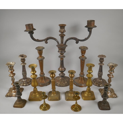 227 - A quantity of antique brass and silver plated candlesticks, largest 46cm high