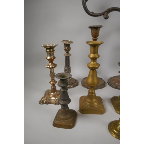 227 - A quantity of antique brass and silver plated candlesticks, largest 46cm high