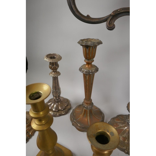 227 - A quantity of antique brass and silver plated candlesticks, largest 46cm high