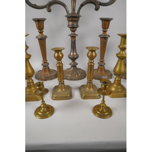 227 - A quantity of antique brass and silver plated candlesticks, largest 46cm high