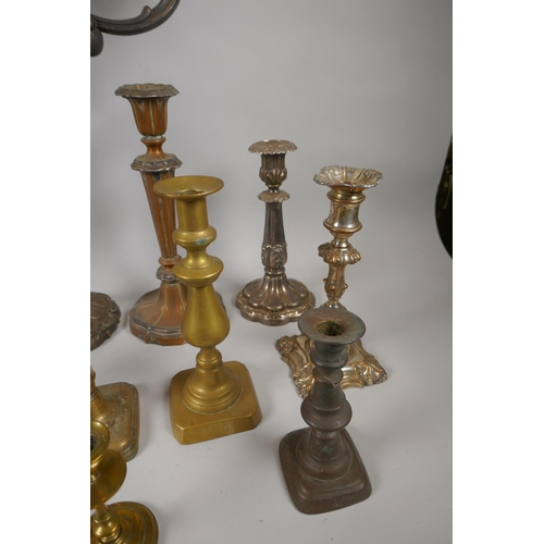 227 - A quantity of antique brass and silver plated candlesticks, largest 46cm high