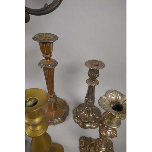 227 - A quantity of antique brass and silver plated candlesticks, largest 46cm high