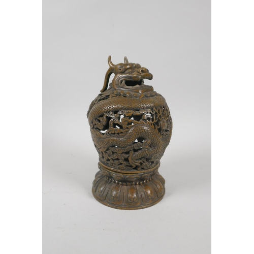 229 - A Chinese pierced bronze censer burner with dragon decoration, 6 character mark to base, 18cm high