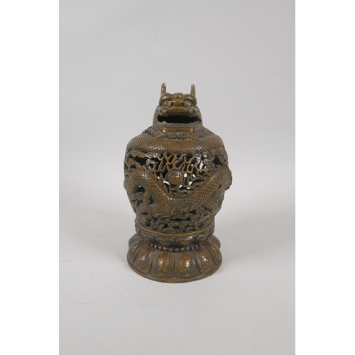 229 - A Chinese pierced bronze censer burner with dragon decoration, 6 character mark to base, 18cm high