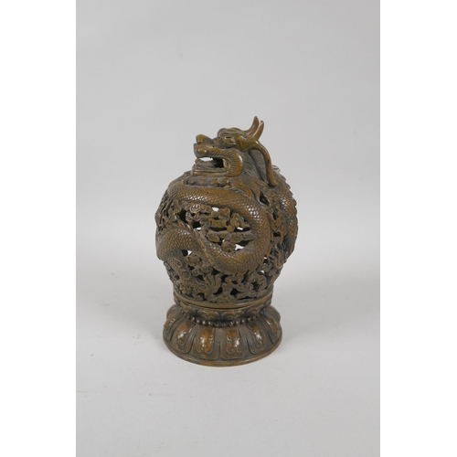 229 - A Chinese pierced bronze censer burner with dragon decoration, 6 character mark to base, 18cm high