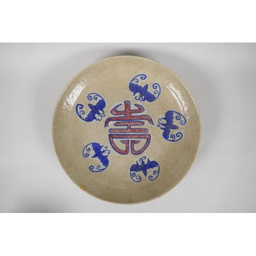 233 - A Chinese crackleware dish with blue and red decoration of bats and auspicious symbols, 26cm diamete... 