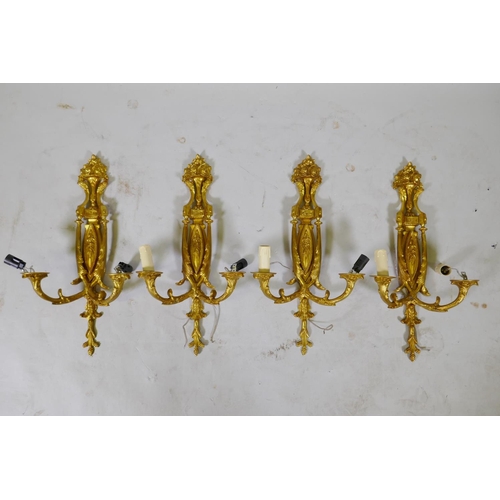 234 - Two pairs of ormolu two branch wall sconces, 50cm