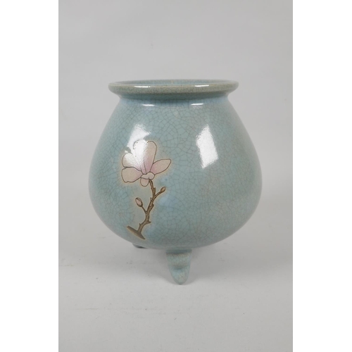 235 - A Chinese celadon crackle glaze jar on tripod supports with floral decoration, 19cm high