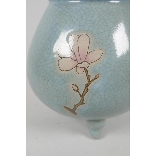 235 - A Chinese celadon crackle glaze jar on tripod supports with floral decoration, 19cm high