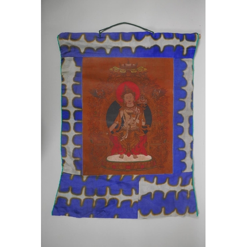 237 - A Tibetan hand coloured Thangka depicting Buddha, 45 x 56cm