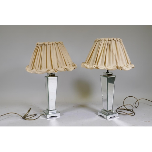 239 - A pair of mirrored glass table lamps, 49cm high