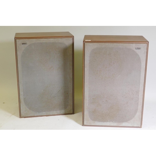 27 - A pair of vintage HiFi speakers, in teak cases with removable wire mesh grills, bearing metal label ... 