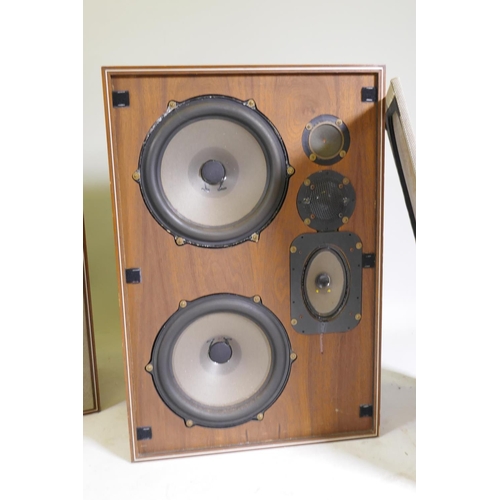 27 - A pair of vintage HiFi speakers, in teak cases with removable wire mesh grills, bearing metal label ... 