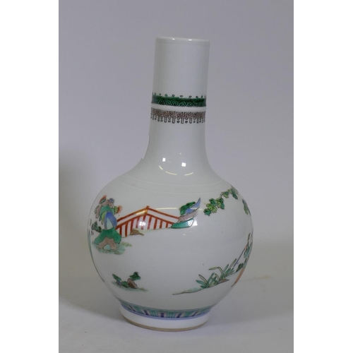 28 - A Chinese famille verte bottle shaped vase, with raised enamel decoration and six character Kanxi ma... 