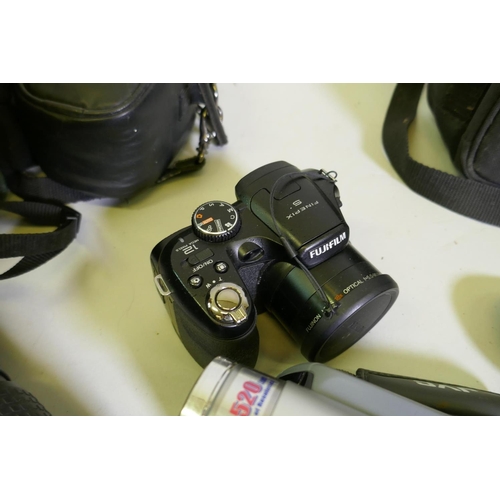 43 - Canon E-10 4 MegaPixel digital camera; Fuji Firepix S, 12 Mega Pixels; JVC GR-D21EK digital video ca... 