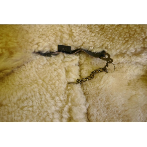 44 - An Italian Shearling leather type B3 US Army Airforce style bomber jacket, size M (although appears ... 