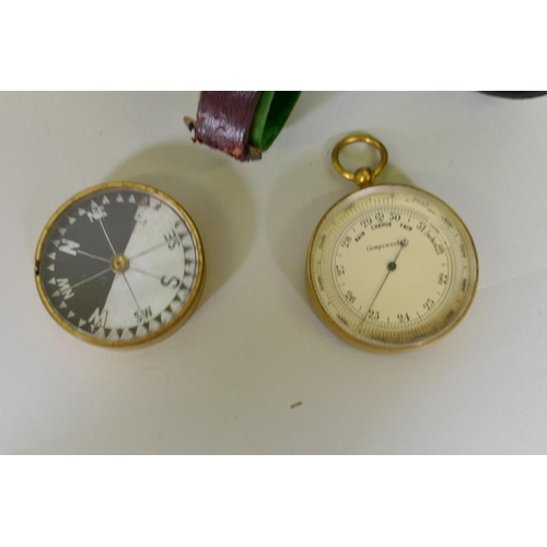 5 - A late C19th gilt brass pocket compensated aneroid barometer/compass, the barometer with rotating be... 