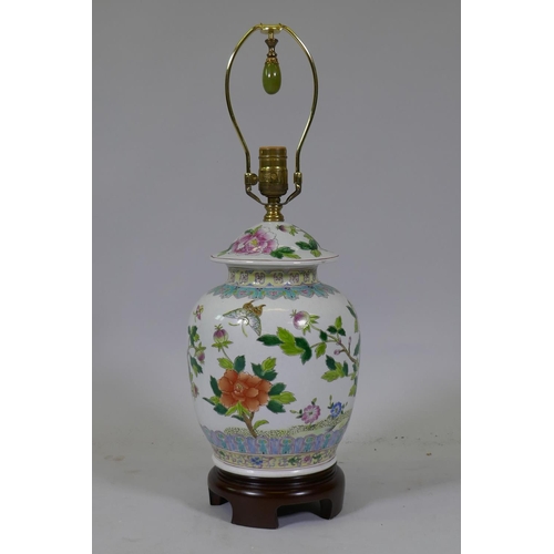 52 - A Chinese famille verte jar and cover, converted to a table lamp, mounted on a wood base, 57cm high