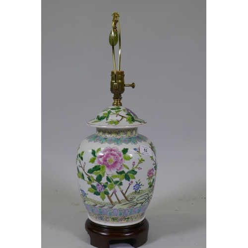 52 - A Chinese famille verte jar and cover, converted to a table lamp, mounted on a wood base, 57cm high