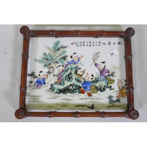 56 - A Chinese tray with faux bamboo carved gallery and inset porcelain panel decorated with seven boys a... 