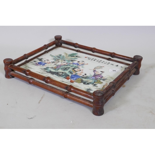 56 - A Chinese tray with faux bamboo carved gallery and inset porcelain panel decorated with seven boys a... 